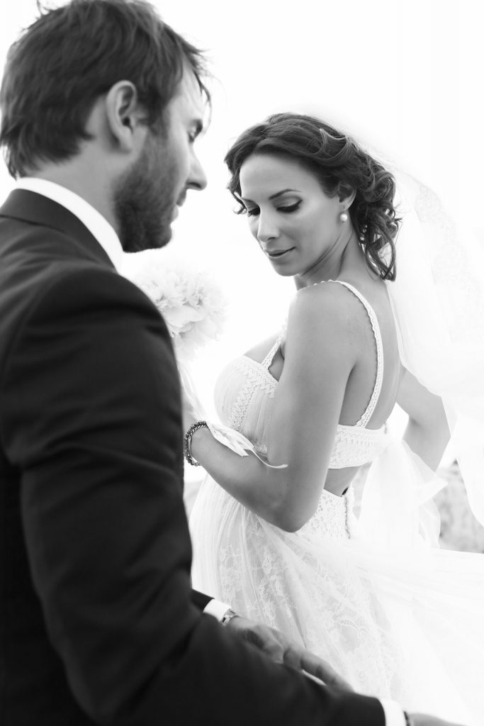 Bride and groom silhouette dramatic sunset clouds Voidokilia beach Messinia Greece coastal destination wedding photography