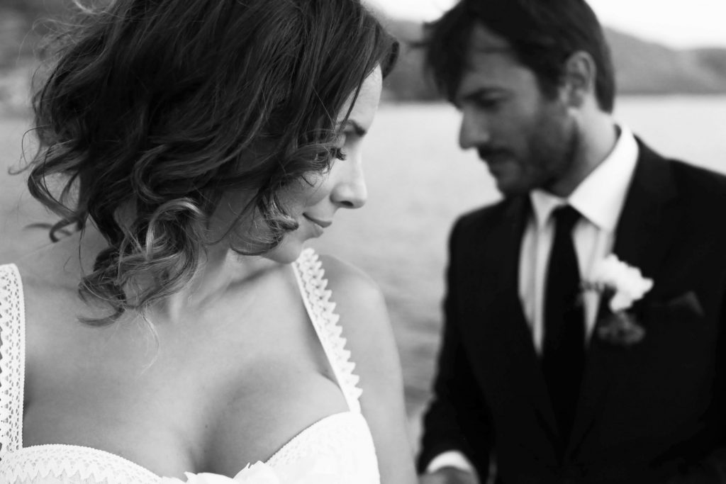 Bride and groom silhouette dramatic sunset clouds Voidokilia beach Messinia Greece coastal destination wedding photography