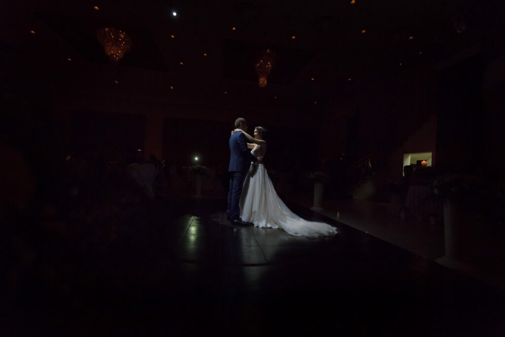 Bride and groom first dance elegant ballroom crystal chandeliers Greece wedding reception destination wedding photography
