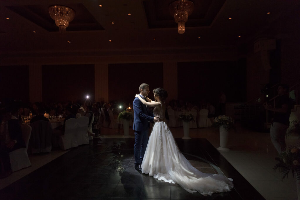 Bride and groom first dance elegant ballroom crystal chandeliers Greece wedding reception destination wedding photography