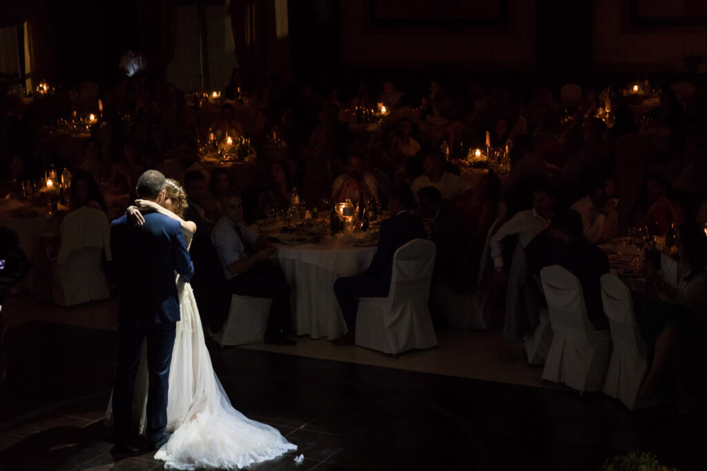 Bride and groom first dance elegant ballroom crystal chandeliers Greece wedding reception destination wedding photography