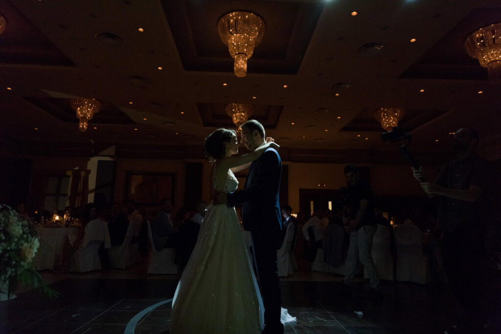 Bride and groom first dance elegant ballroom crystal chandeliers Greece wedding reception destination wedding photography