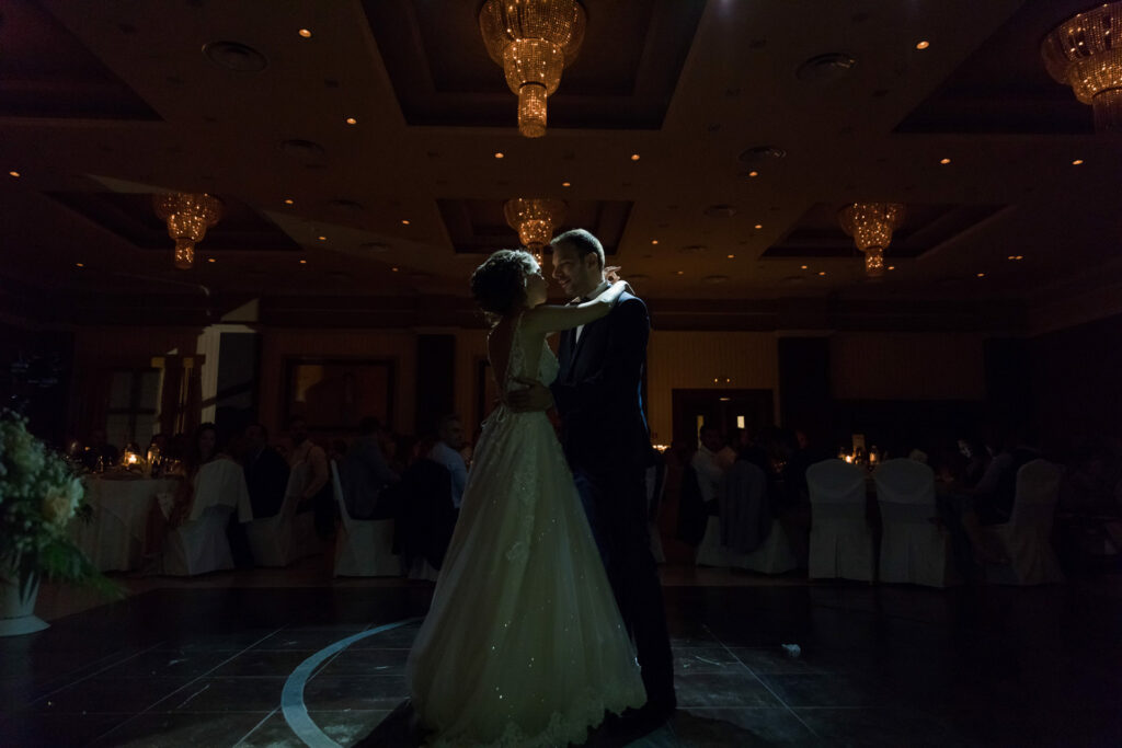 Bride and groom first dance elegant ballroom crystal chandeliers Greece wedding reception destination wedding photography
