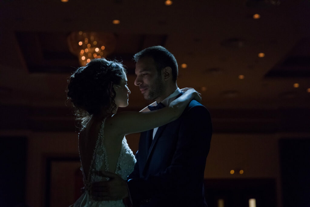Bride and groom first dance elegant ballroom crystal chandeliers Greece wedding reception destination wedding photography