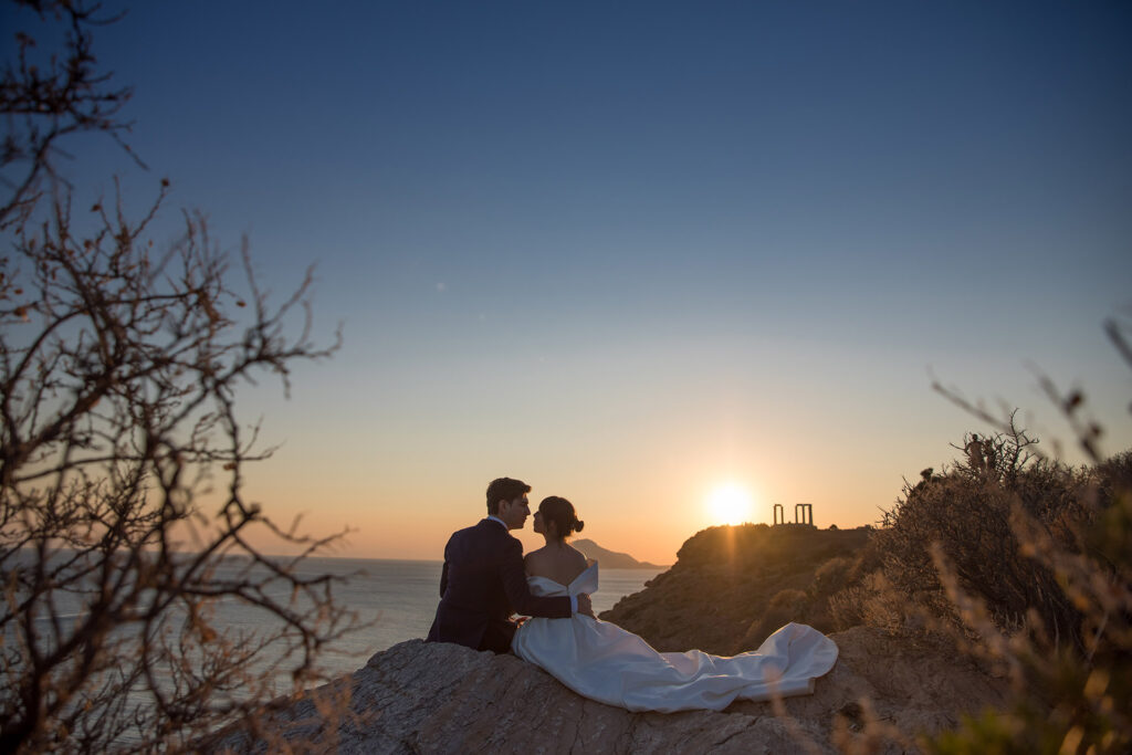 Bride and groom romantic sunset portrait Temple of Poseidon Cape Sounion Greece destination wedding photography